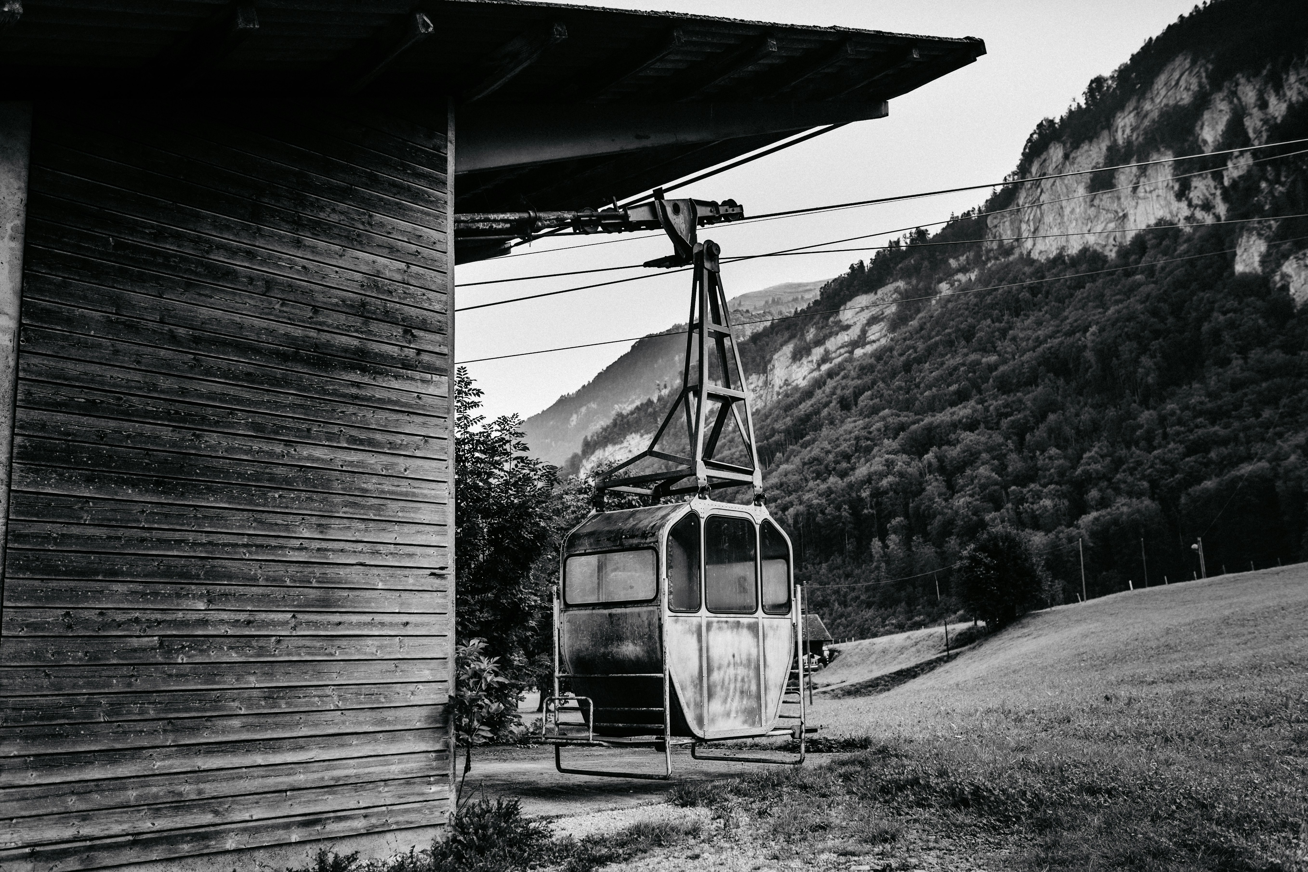 grayscale photo of a train in a tunnel